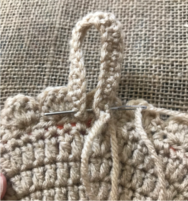 how to stitch a hanging loop to backside of work.