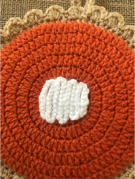 finished and secure hot pad whipped cream embellishment - pumpkin pie crochet hot pad and coasters pattern